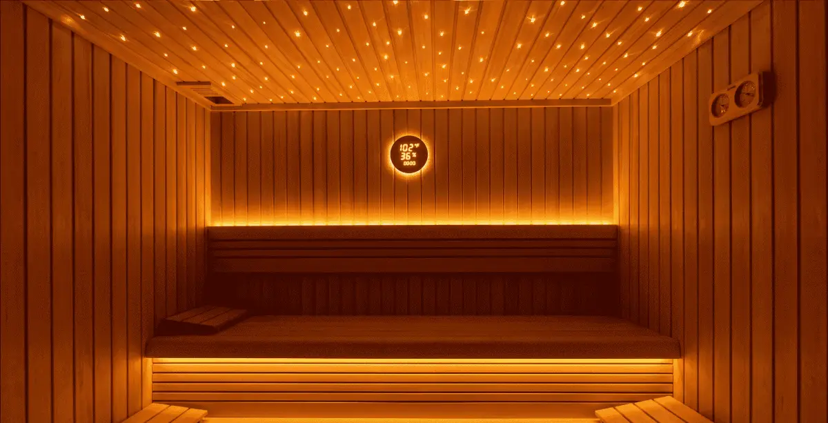 Finnish sauna in red cedar with a fibre-optic star ceiling and LED-lit benches in a private villa